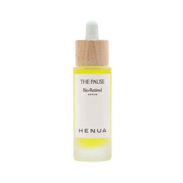 Bottle of The Pause Bio-Retinol serum with a wooden dropper cap and white label showing brand name Henua.