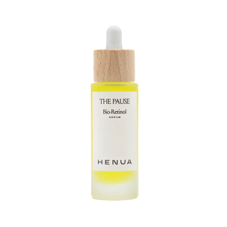 Bottle of The Pause Bio-Retinol serum with a wooden dropper cap and white label showing brand name Henua.